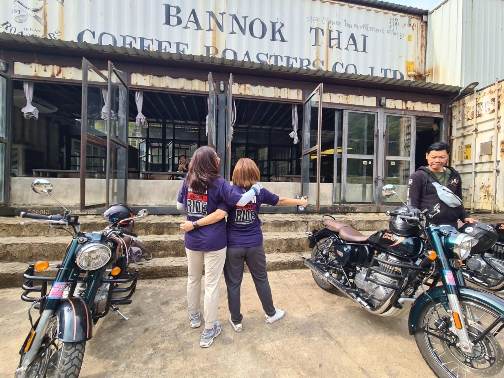 Guide and riders at a mountain viewpoint
